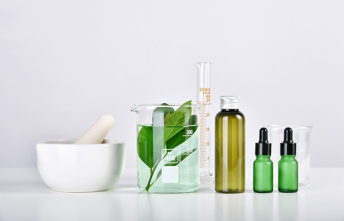 An image of bottles that contain creams and other skincare products infused with green tea.