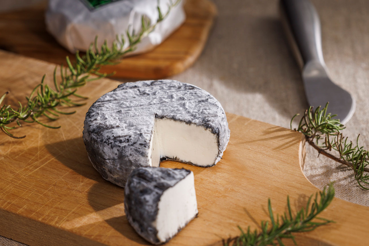 Photos of one of Y & Co.'s goat's milk cheese series. Caprino Black